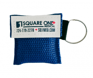 Red keychain with Square One logo containing CPR Facemask
